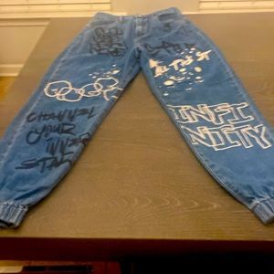 Blue jeans with designs on front and back size 5/27 joggers